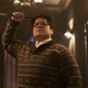 Guillermo raises a wooden stake in his trademark sweater on What We Do in the Shadows.